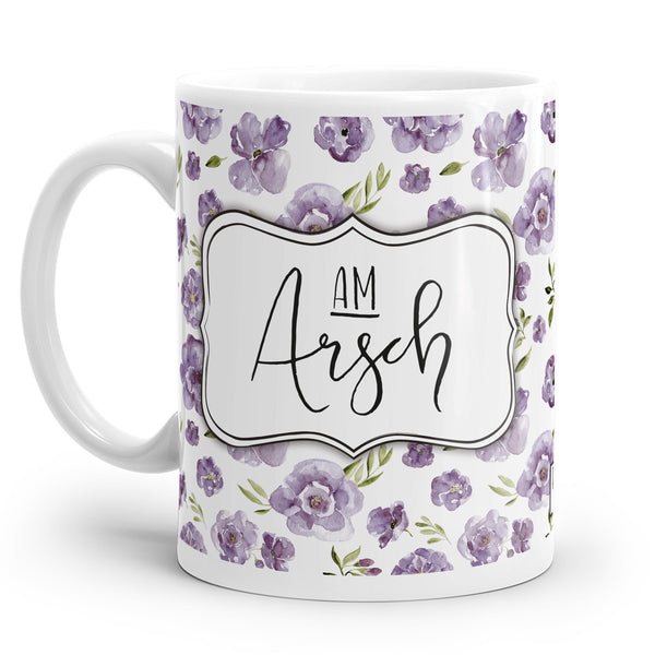 Lustige Tasse mit kitschigen lila Blümchen und frechem Spruch.